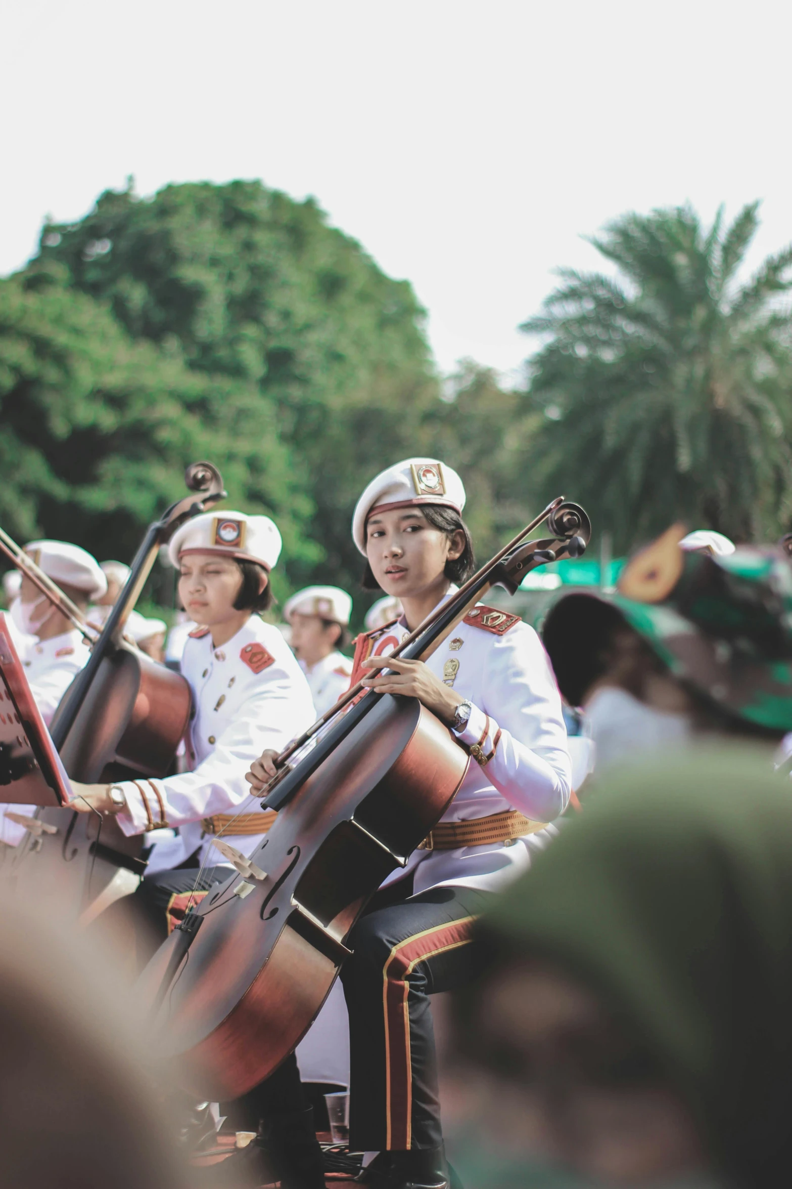 a group of people in uniform playing musical instruments