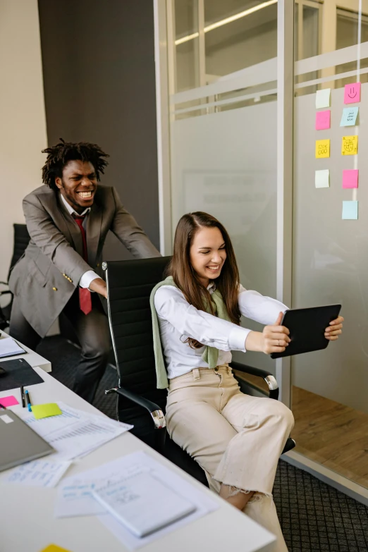 two young business people sitting in an office