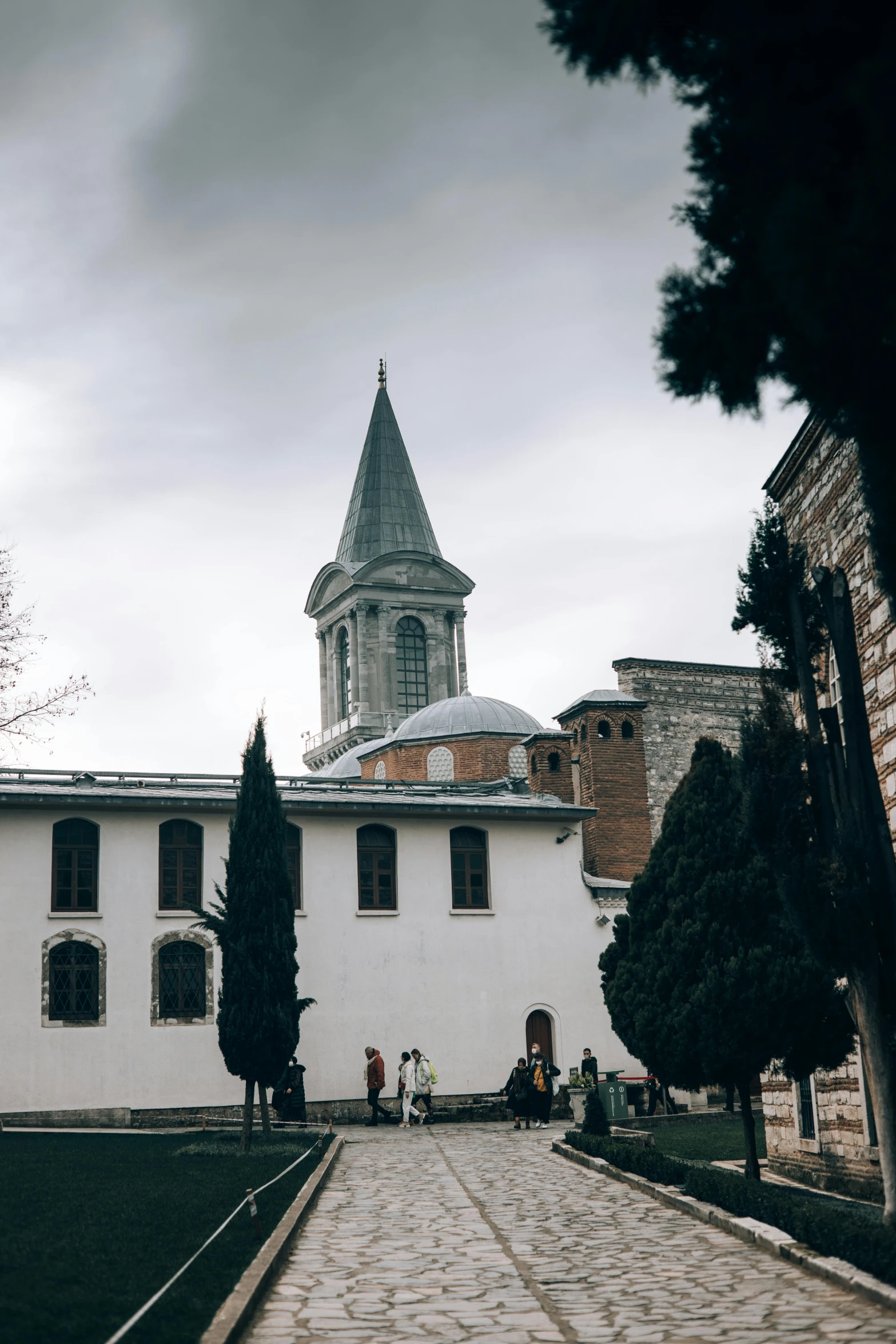 an image of a building with a tower in the background