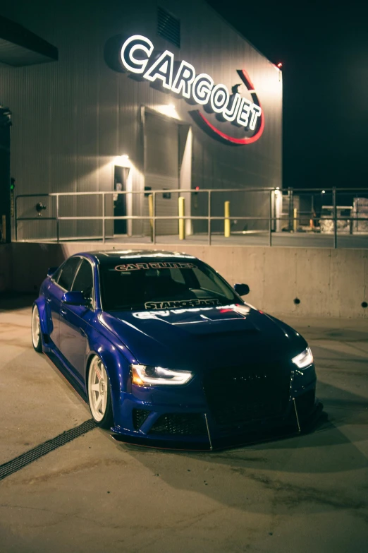 an image of a car parked in front of the gas station