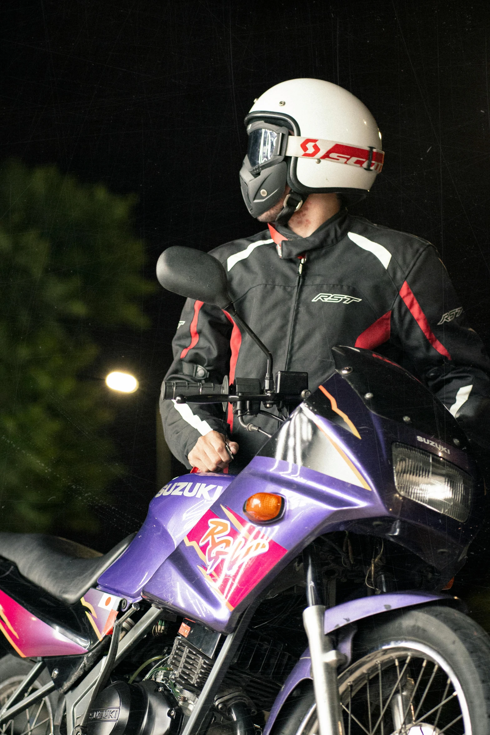 a person in a helmet on a motorcycle