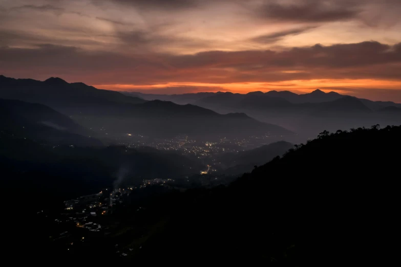 a view of the mountains with the city below them