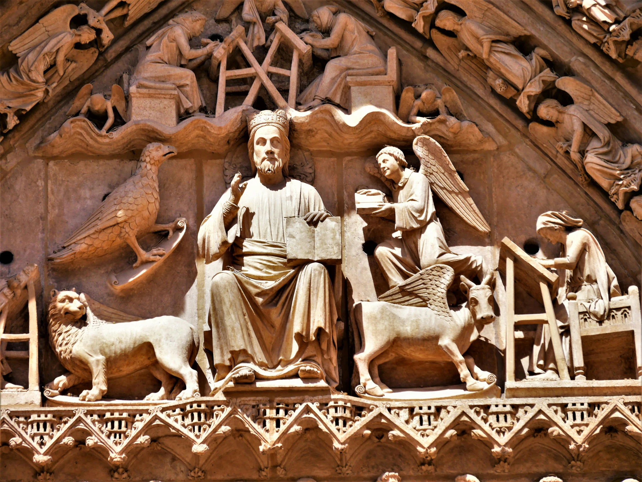 statues on the outside of a building of ancient architecture