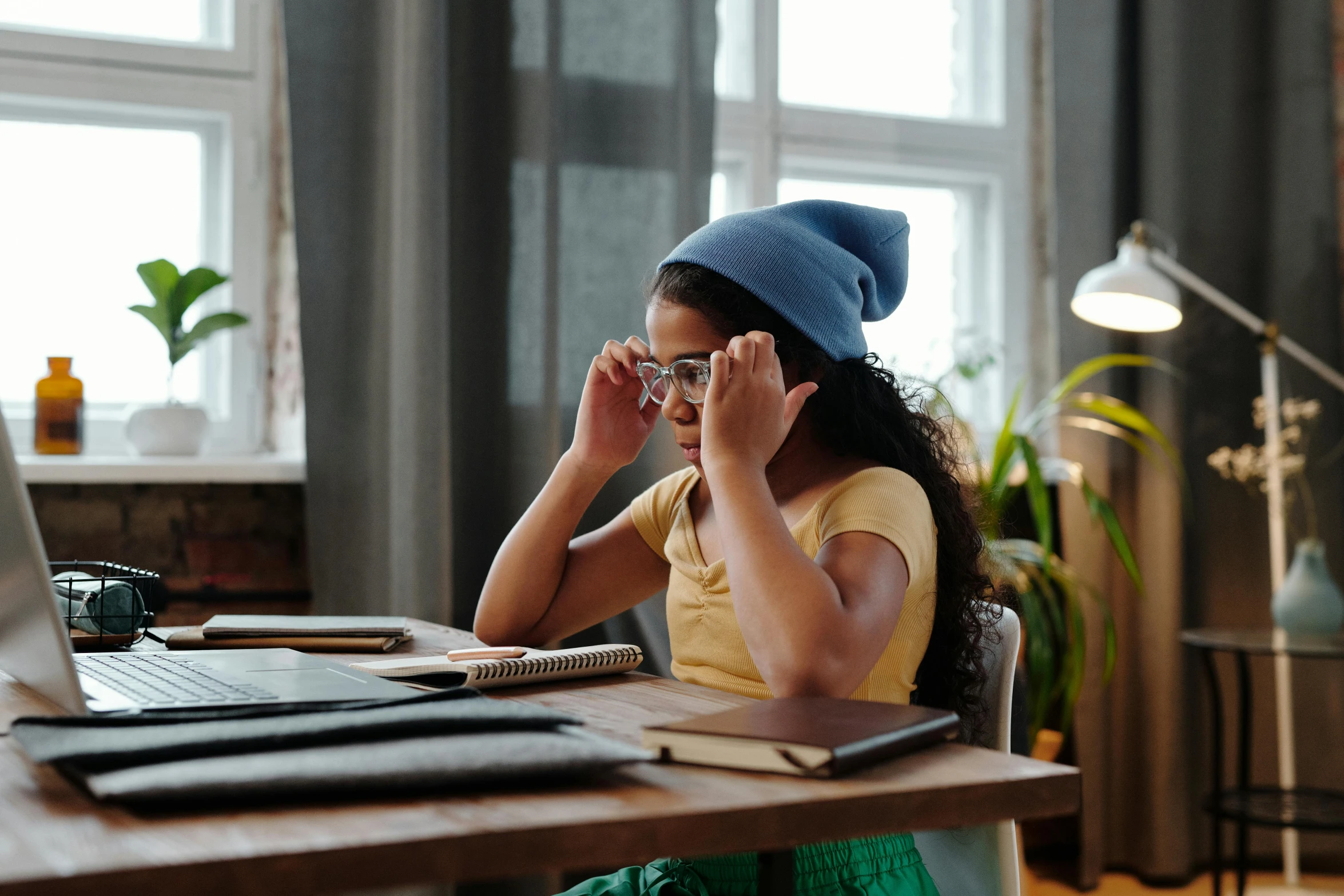  wearing hat, glasses and glasses looking into the distance