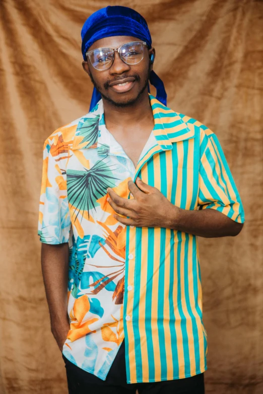 a young black man wearing an uniquely designed shirt