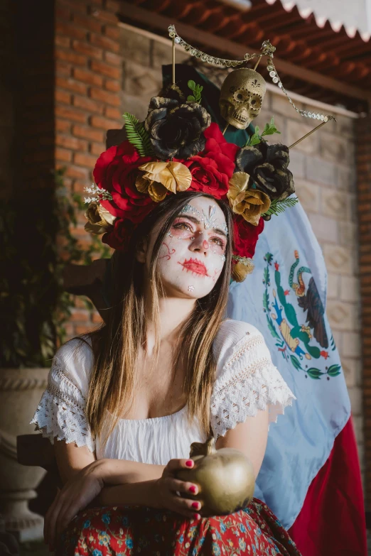 a beautiful young lady with painted makeup and roses on her head