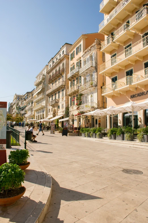 a large open plaza with lots of parked cars