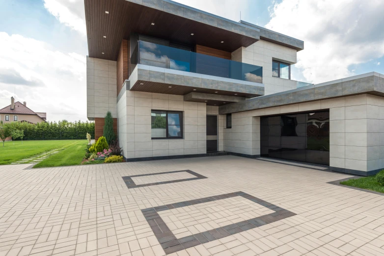 modern building with driveway and three car garage