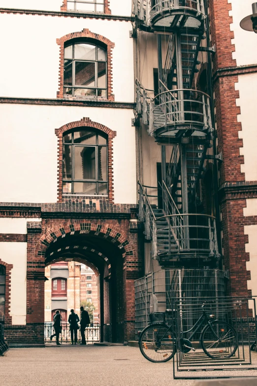 a tall fire escape gate with stairs and stairs