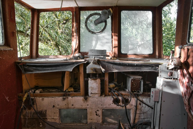 an abandoned building with lots of windows that have been boarded up