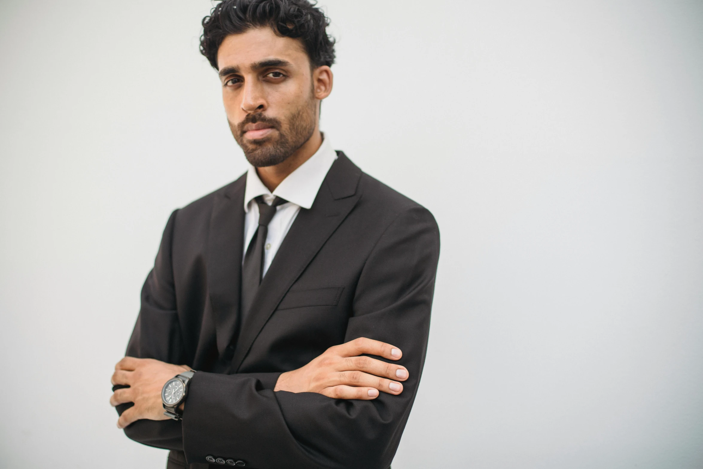 a man is looking pensive in a suit