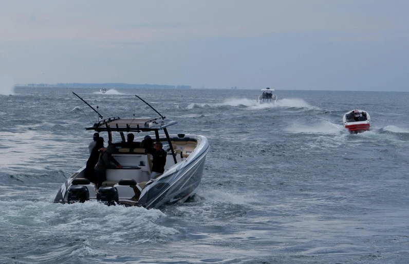 the motor boat is traveling through the rough water