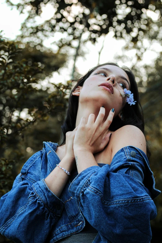 a woman leaning on her lap and touching the skin of her hand