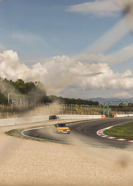 the vehicles are going down the curve of a race track