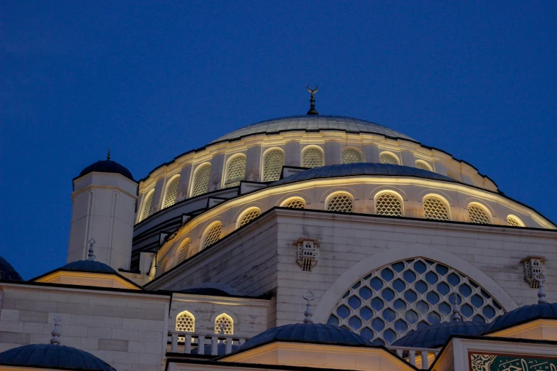 a large building with a light covering it