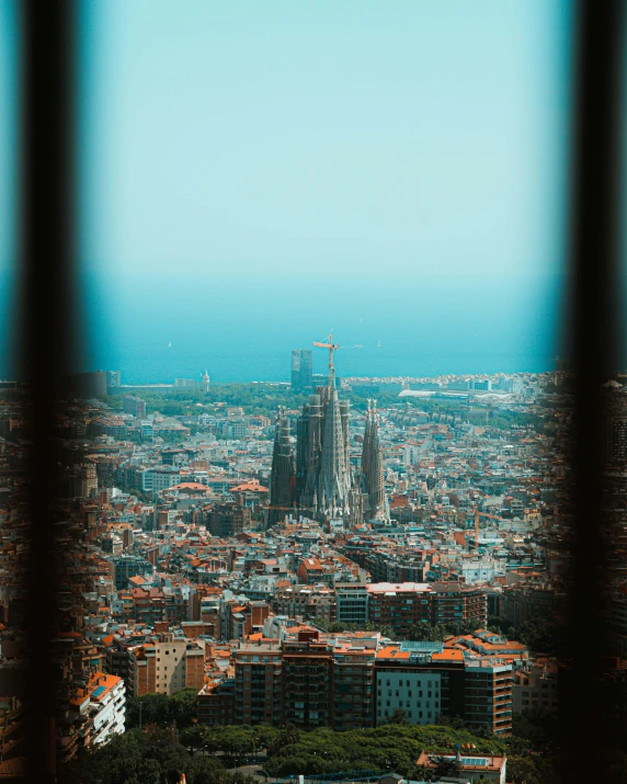 view from a tall building looking at the city and the surrounding area