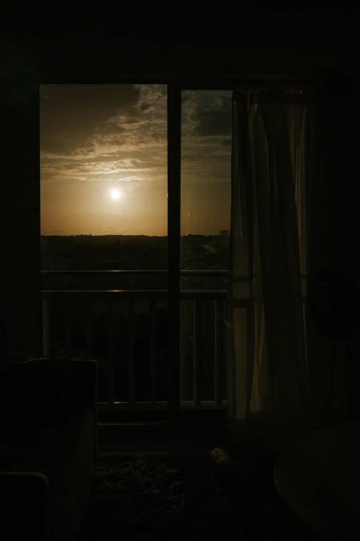 a view out a window at sunset or sunset