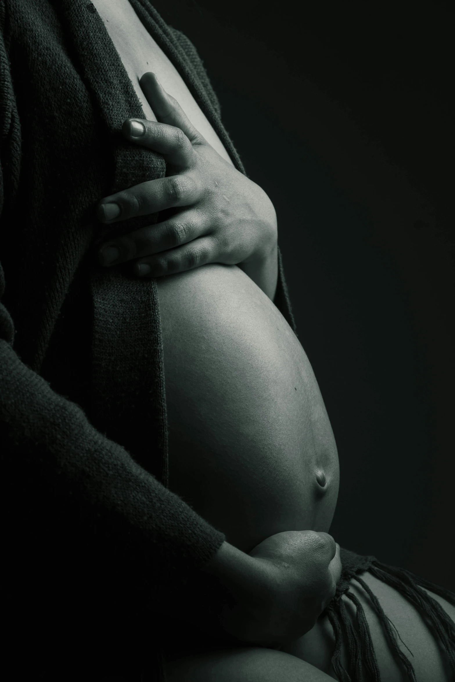 a woman with her  covered by black and white