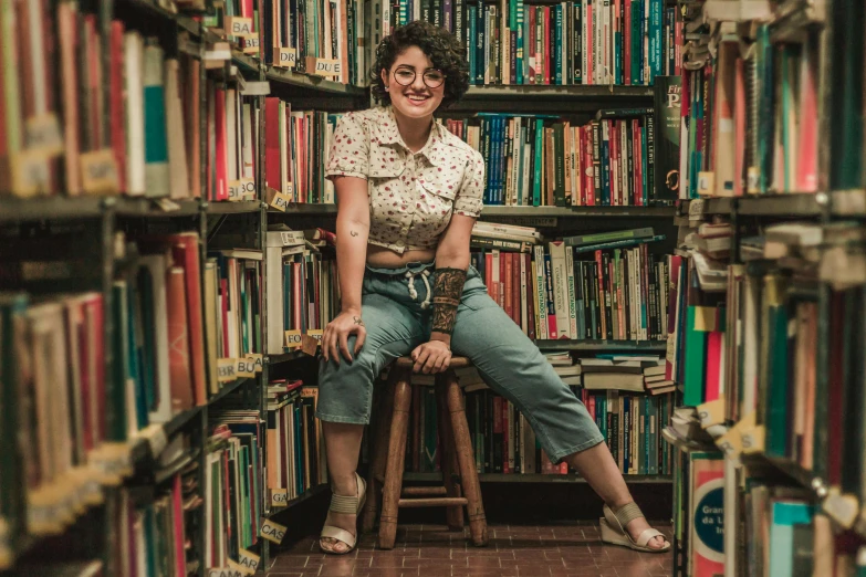 a woman sitting on a chair in a liry surrounded by many books