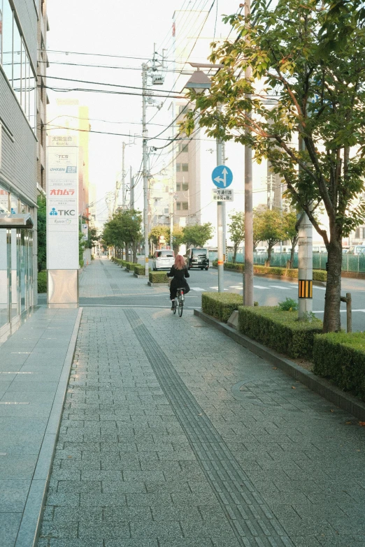 a man riding a bicycle on a street