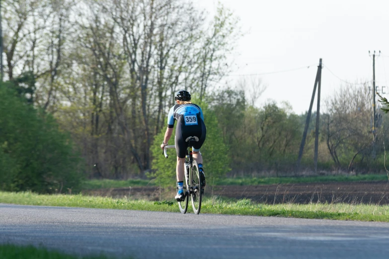 a man riding his bike down the street