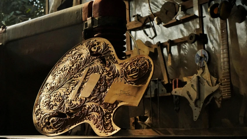 a guitar being worked on by an artisan