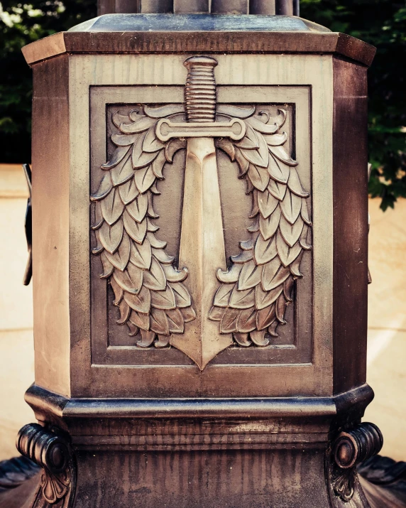 a decorative monument that appears to be an angel with wings and a cross