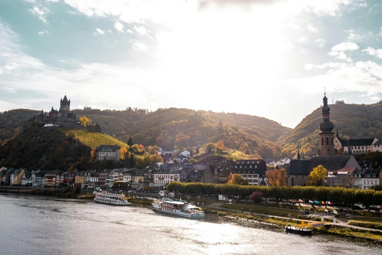 a river is in front of a hill and trees