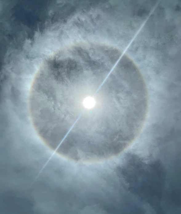 the sun seen through clouds in the sky