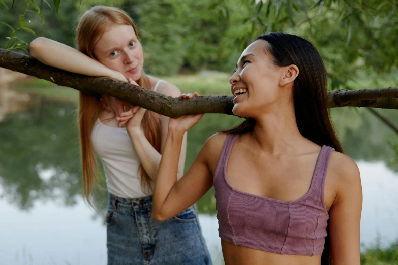 two girls smiling as they pose for a po