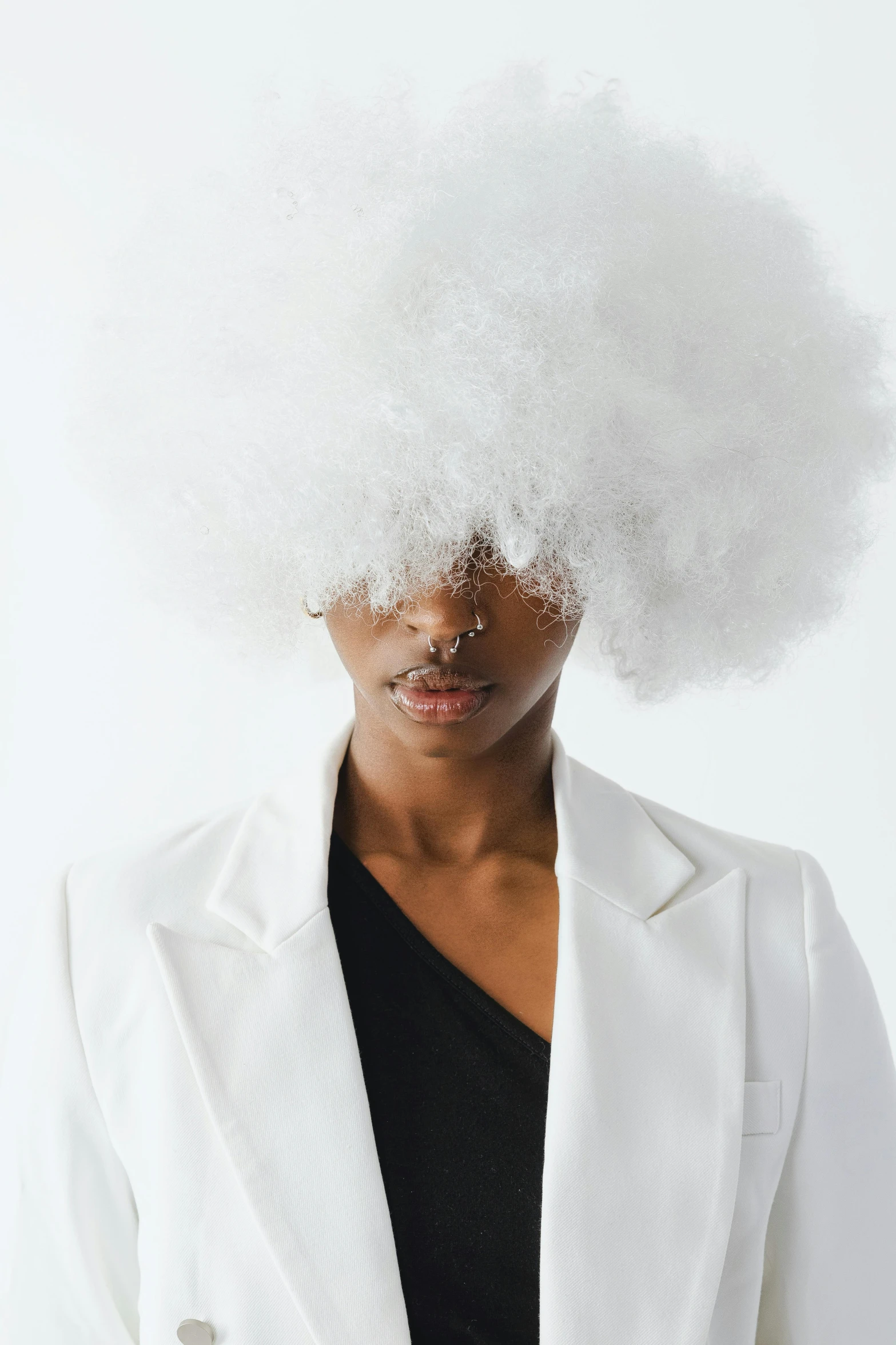 a man in a white suit and a white wig