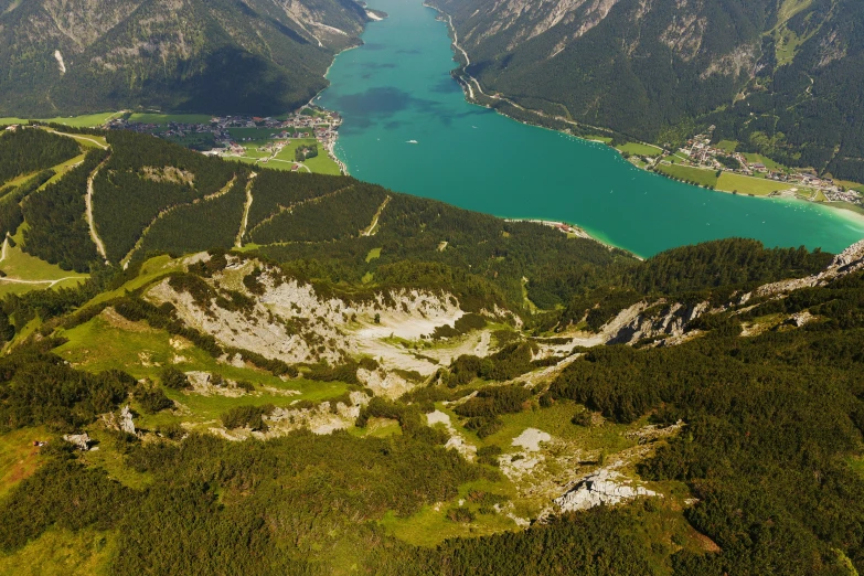 an aerial view of the mountains, river and water