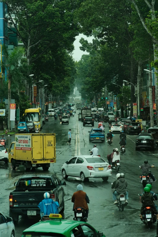 a road filled with lots of cars and motorcycles