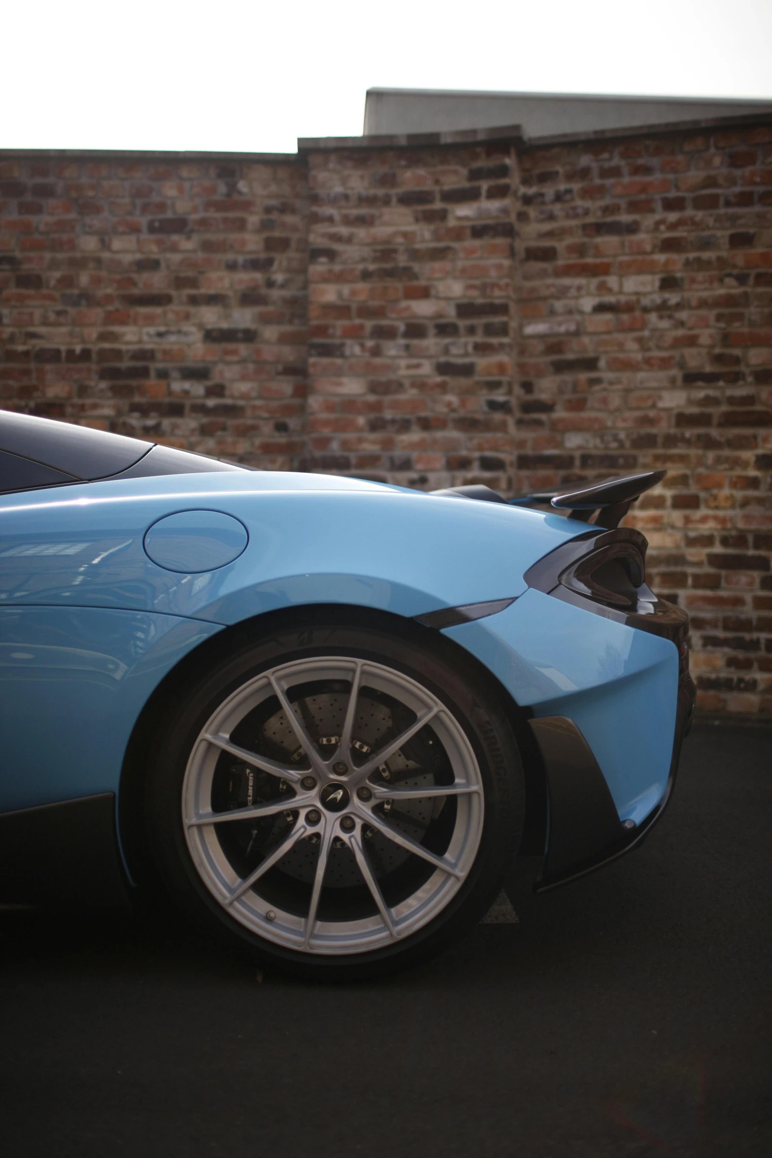 the blue car is parked on the street