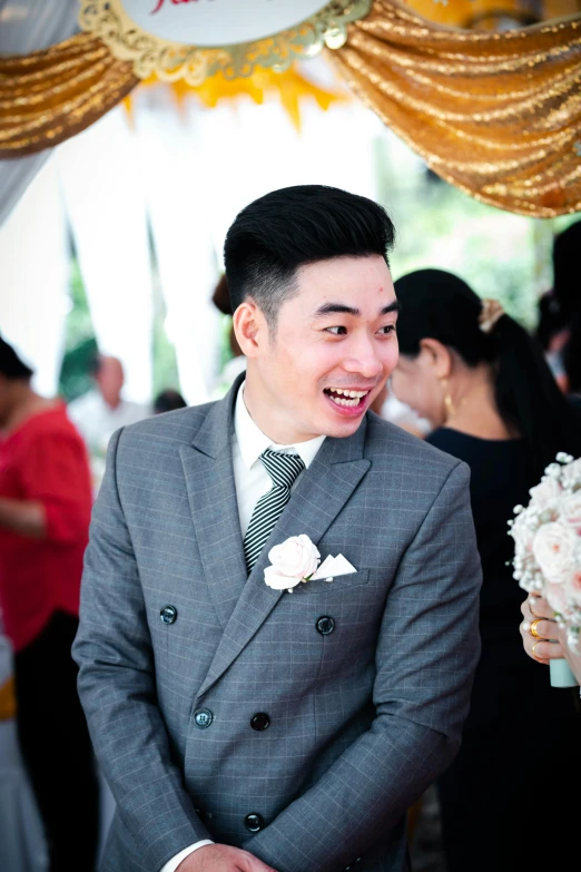 a young man laughing at his bride