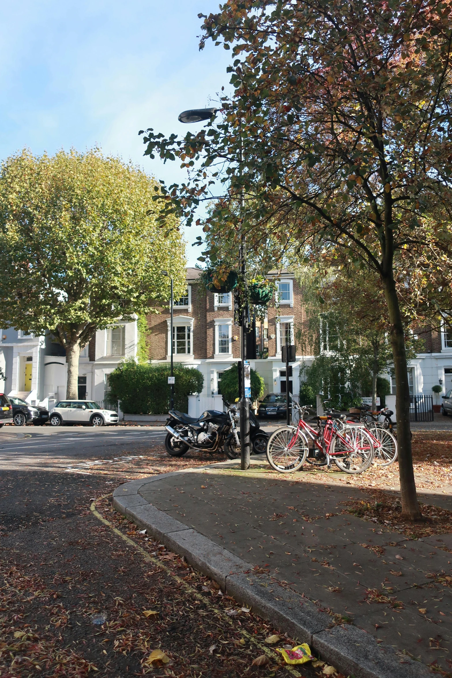 a view of a street with a stoplight in the background