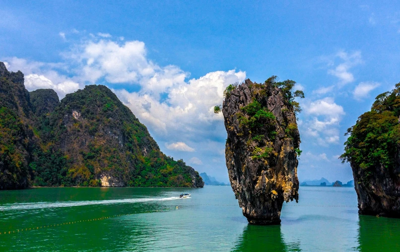 a large group of cliffs in the middle of a body of water