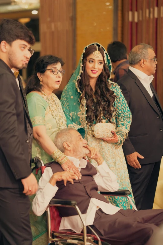 an elderly man sitting in a wheelchair