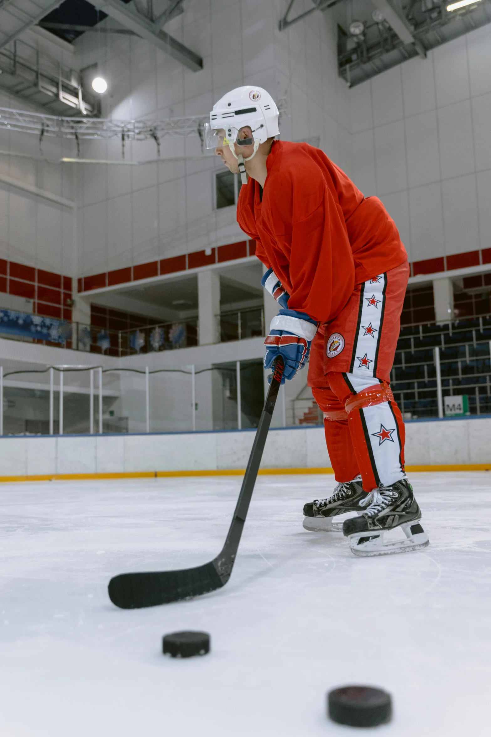 a hockey player with his board in hand