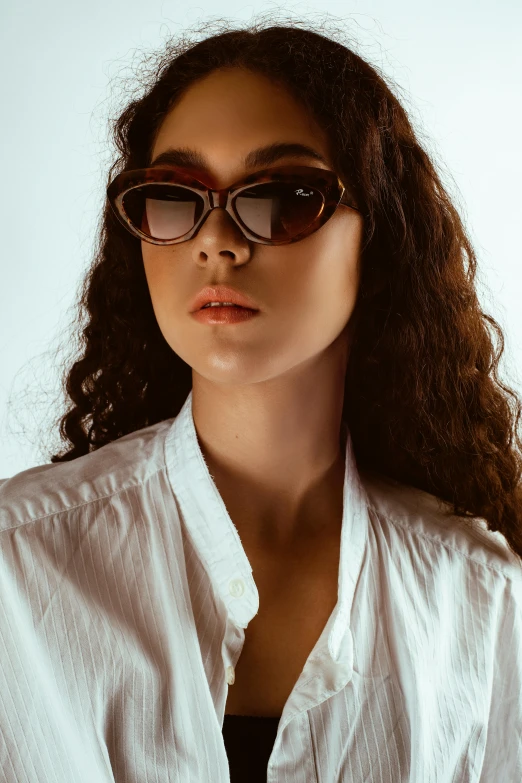 a woman in sunglasses posing for a picture