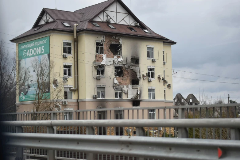 a large building with several windows and holes in the front