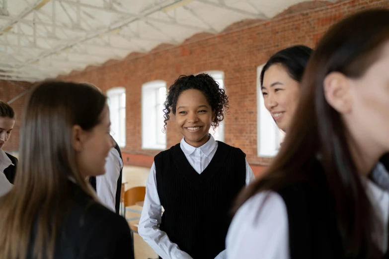 an asian girl in a school uniform with other students