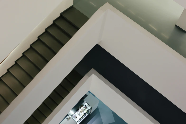 a staircase with an open skylight above it