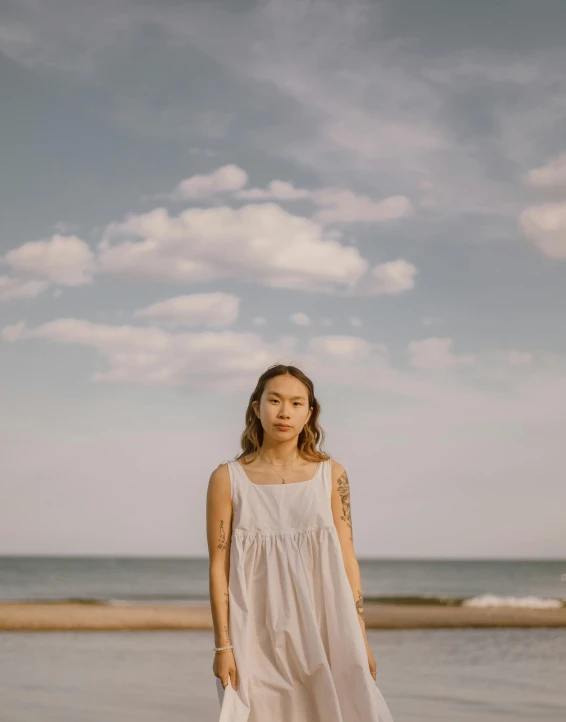 a woman posing for a po on the beach