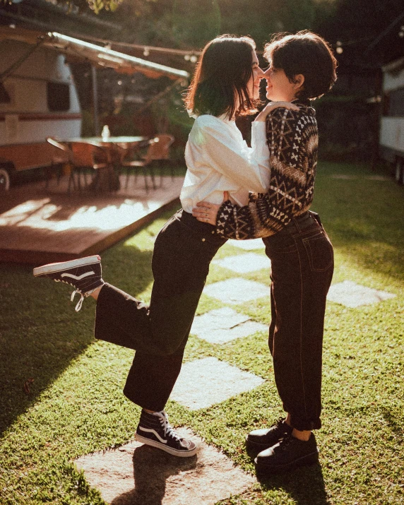 a couple playing in the yard of their home