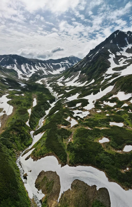 a scenic view of the snowy mountains in the distance