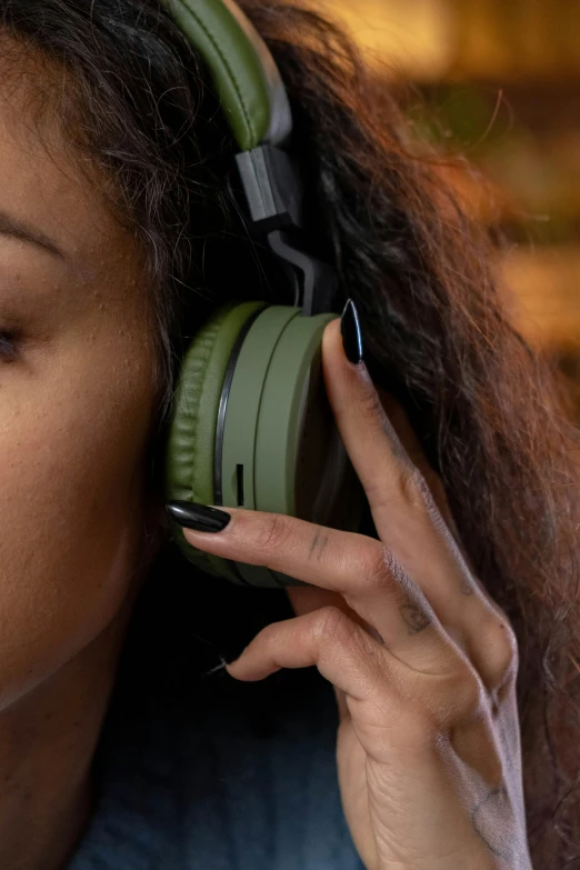 there is a woman listening to some kind of headphones