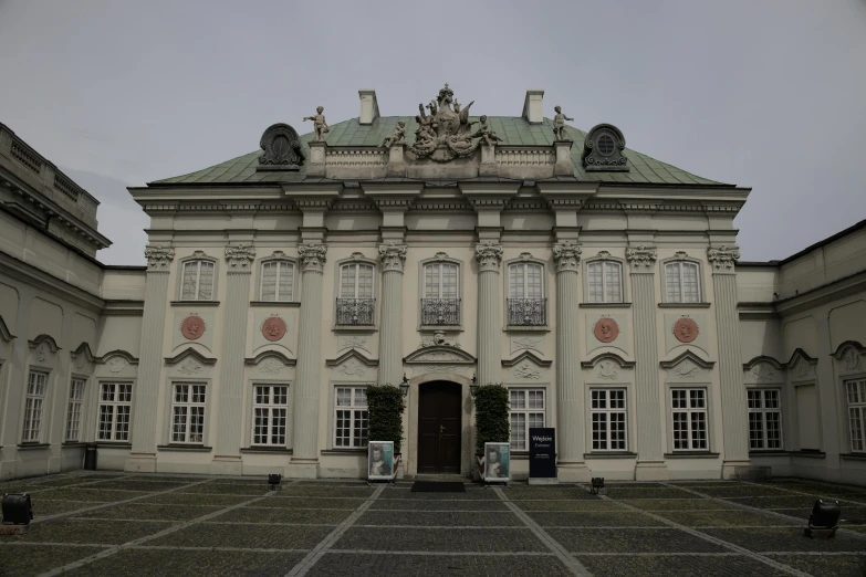 a large building with ornate architecture and a statue