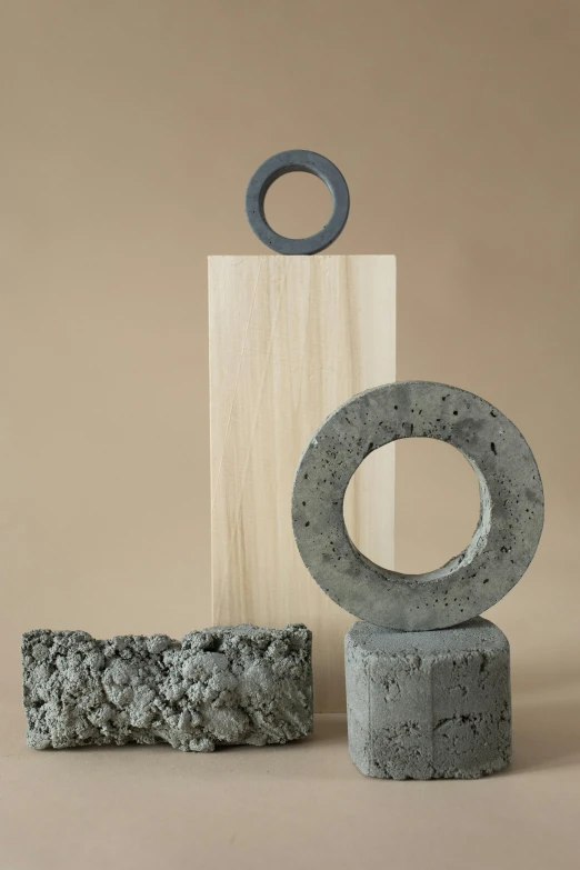 a couple of concrete sculptures sitting on top of a floor