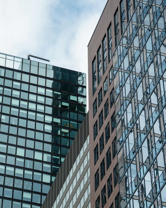 several buildings that are all glass and have multiple angles